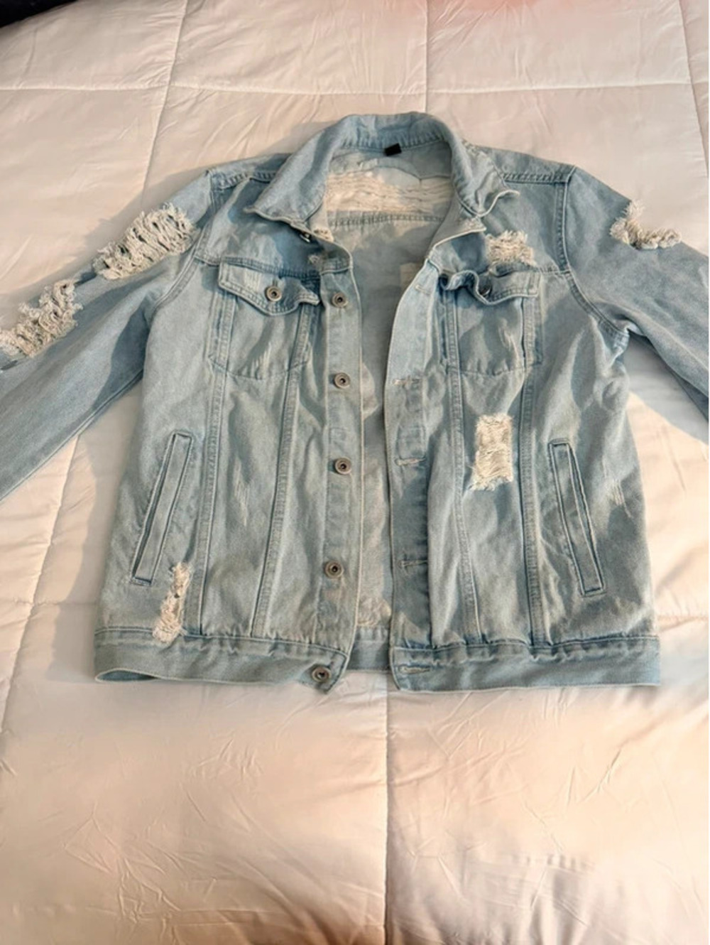 Blue denim jacket with distressed details, size M